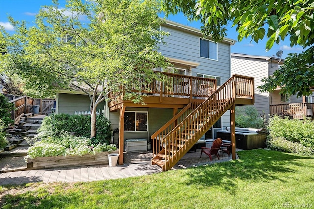 735 Poppy Pl, Highlands Ranch, CO 80129 - rear view of property featuring a hot tub, a wooden deck, a patio, and stairway
