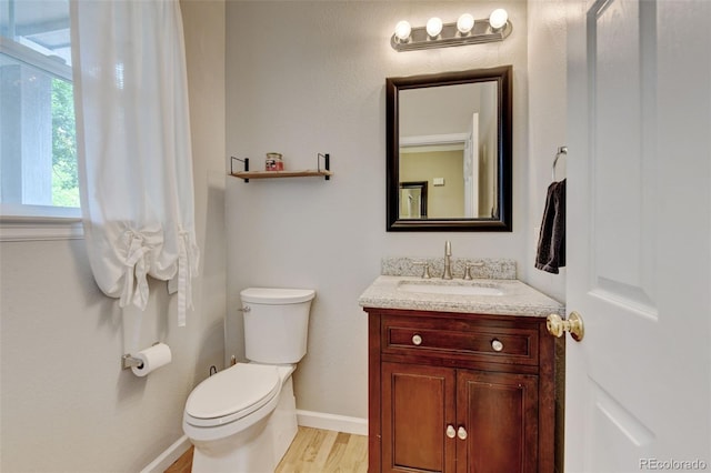 13025 Umatilla Ct, Denver, CO 80234 - bathroom featuring vanity and wood finished floors