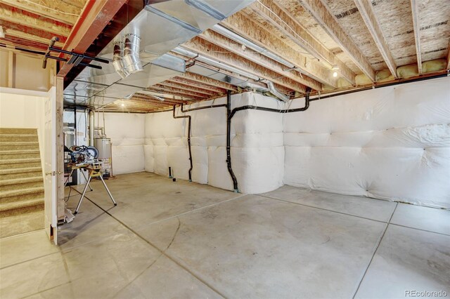 13025 Umatilla Ct, Denver, CO 80234 - unfinished below grade area featuring stairway and gas water heater