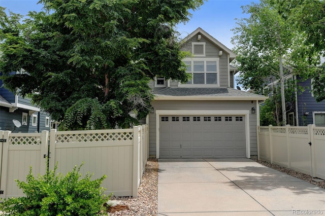13025 Umatilla Ct, Denver, CO 80234 - garage featuring concrete driveway and a gate