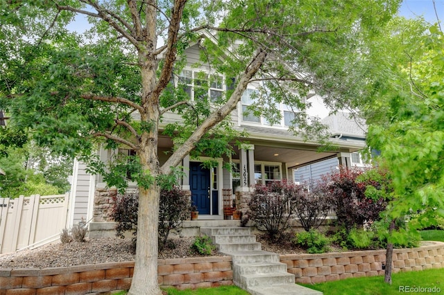 13025 Umatilla Ct, Denver, CO 80234 - view of property hidden behind natural elements with a porch