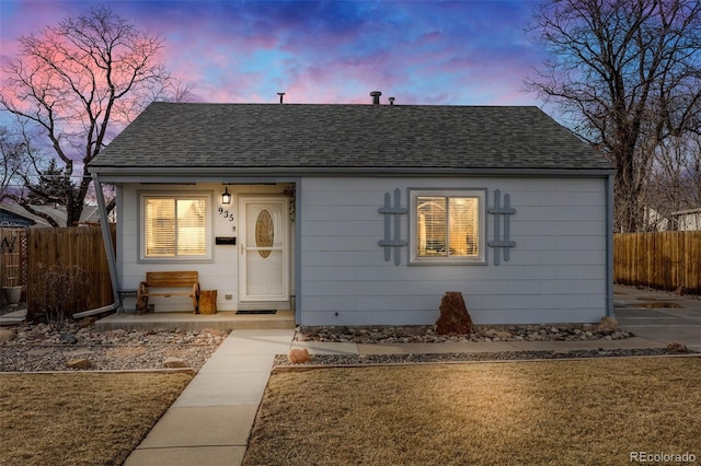 bungalow-style home featuring a yard