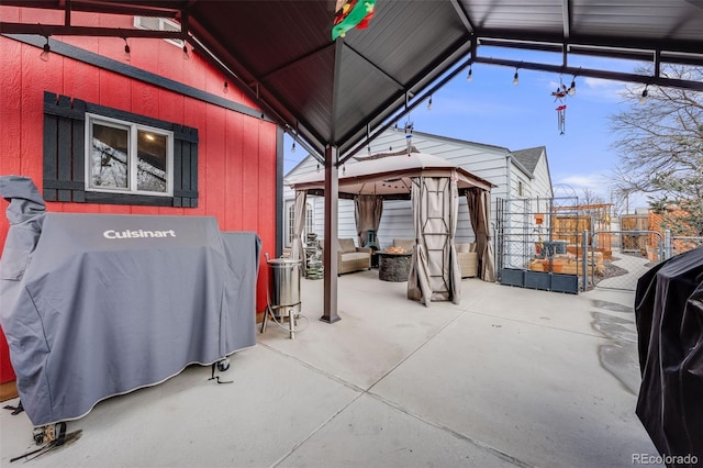 view of patio / terrace featuring a gazebo and a grill