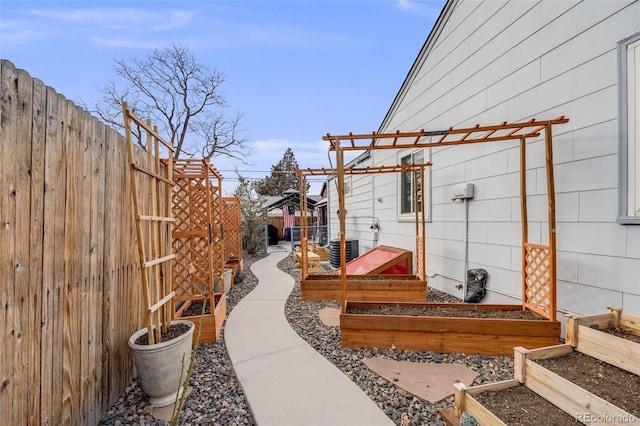 view of yard featuring cooling unit and a pergola