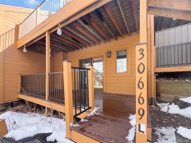 view of snow covered deck