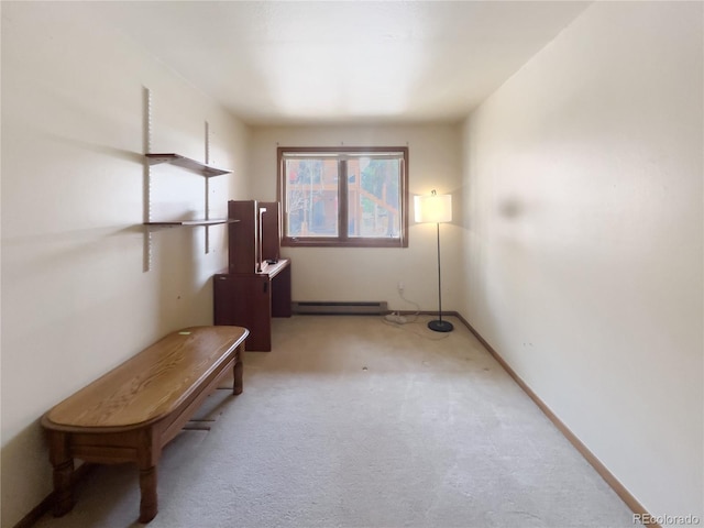 interior space featuring light carpet, a baseboard radiator, and baseboards