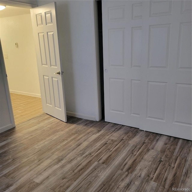 970 S Peoria St, Aurora, CO 80012 - unfurnished bedroom with wood finished floors