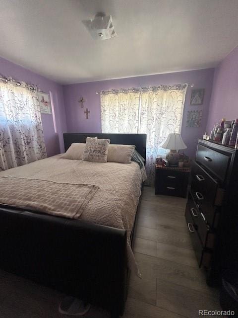 bedroom featuring hardwood / wood-style flooring