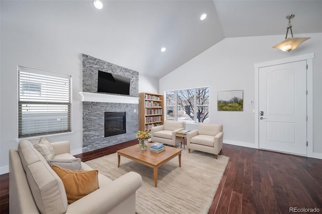 3063 Denver Dr, Fort Collins, CO 80525 - living room featuring a fireplace, lofted ceiling, and dark hardwood / wood-style floors