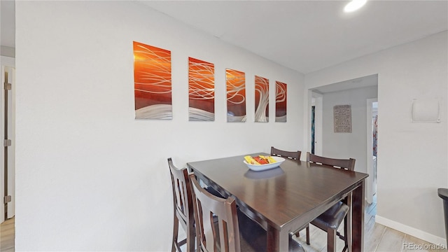 dining room with light hardwood / wood-style floors