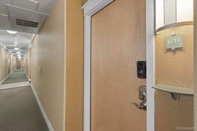 hallway featuring carpet flooring