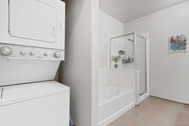 laundry area with stacked washer / dryer