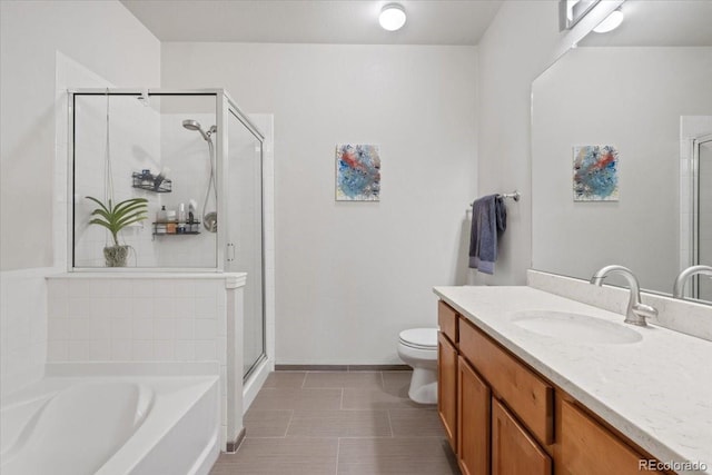 full bathroom with toilet, tile patterned flooring, separate shower and tub, and vanity