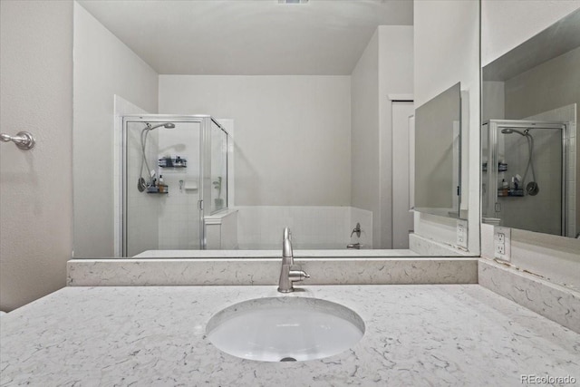 bathroom featuring sink and a shower with door