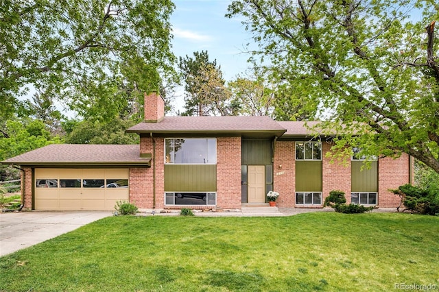 12193 W New Mexico Pl, Lakewood, CO 80228 - view of front of home featuring an attached garage, a chimney, driveway, a front lawn, and brick siding