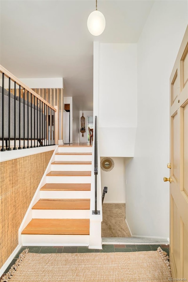 12193 W New Mexico Pl, Lakewood, CO 80228 - staircase featuring baseboards and carpet
