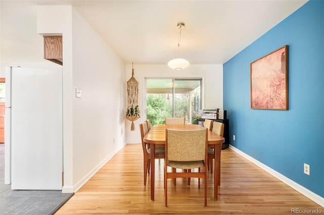 12193 W New Mexico Pl, Lakewood, CO 80228 - dining area featuring light wood-style flooring and baseboards