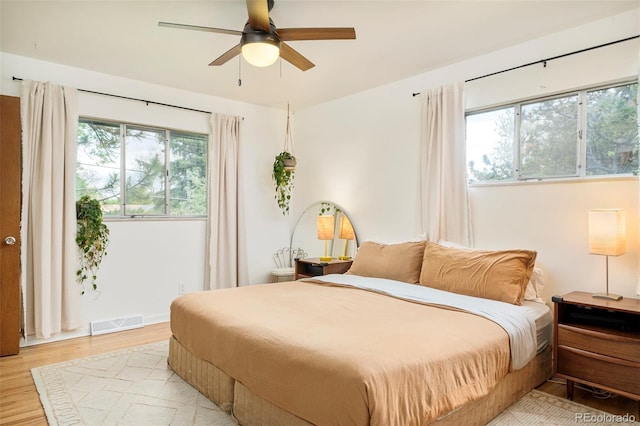 12193 W New Mexico Pl, Lakewood, CO 80228 - bedroom featuring light wood-type flooring and ceiling fan