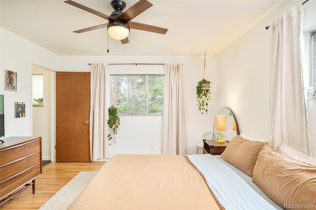 12193 W New Mexico Pl, Lakewood, CO 80228 - bedroom featuring light wood-style floors and ceiling fan