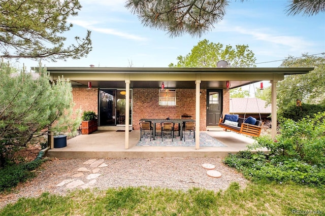 12193 W New Mexico Pl, Lakewood, CO 80228 - back of house featuring a patio and brick siding