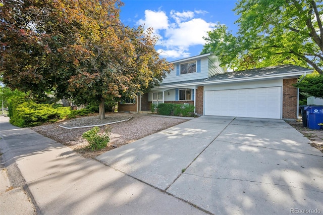 4474 S Vrain St, Denver, CO 80236 - traditional home featuring brick siding, a garage, and driveway