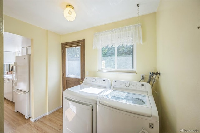 4474 S Vrain St, Denver, CO 80236 - laundry room featuring light wood-style flooring and washing machine and dryer