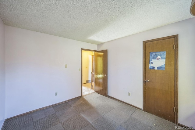 4474 S Vrain St, Denver, CO 80236 - empty room with a textured ceiling and baseboards