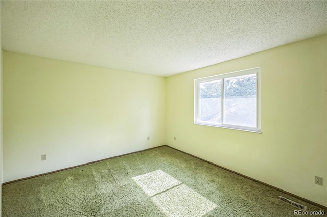 4474 S Vrain St, Denver, CO 80236 - spare room with carpet, a textured ceiling, and baseboards