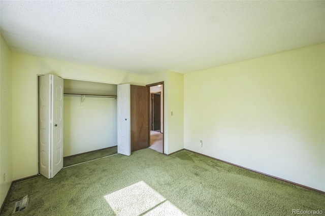 4474 S Vrain St, Denver, CO 80236 - unfurnished bedroom with carpet floors, a closet, a textured ceiling, and baseboards