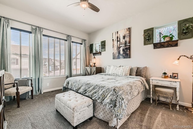 bedroom with ceiling fan and dark carpet