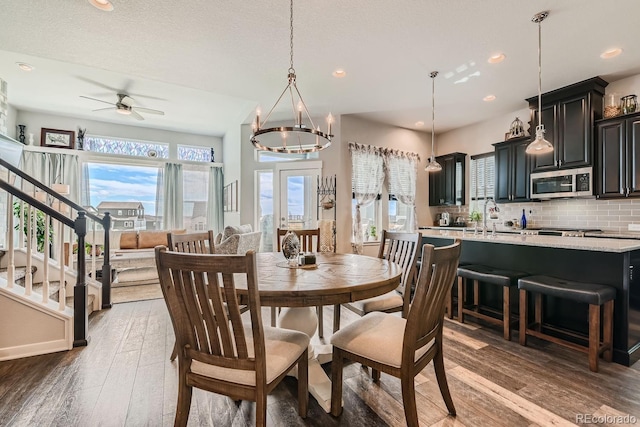 dining room with ceiling fan, dark wood-type flooring, and plenty of natural light