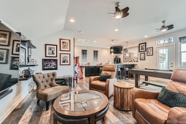 living room featuring ceiling fan, indoor bar, hardwood / wood-style floors, billiards, and vaulted ceiling