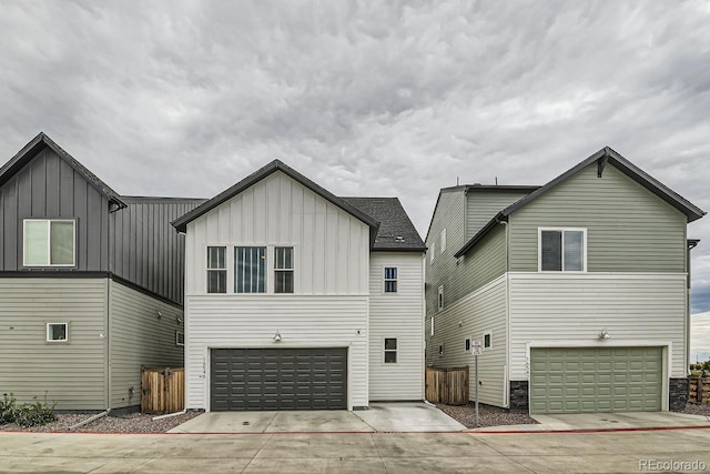 back of house with a garage