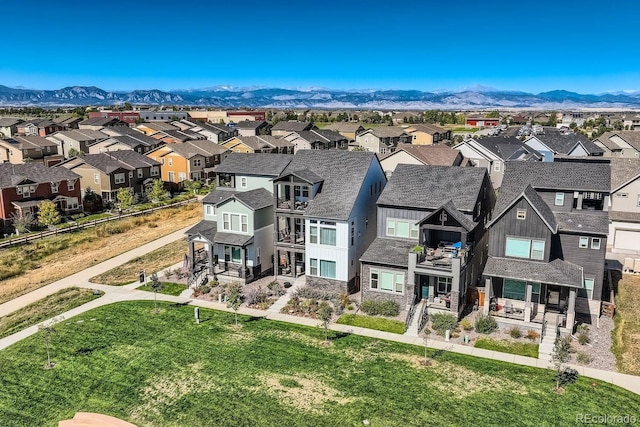 birds eye view of property with a mountain view