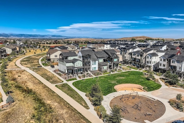 birds eye view of property with a mountain view