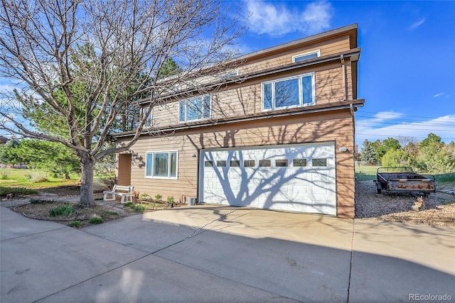 traditional-style house with concrete driveway and a garage