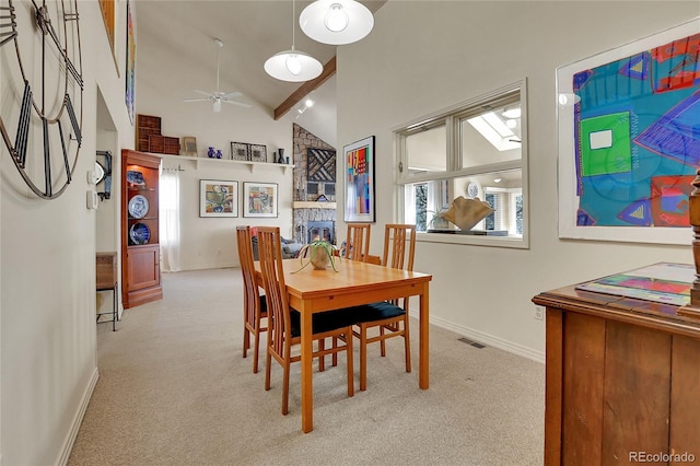 dining area featuring visible vents, baseboards, carpet, a ceiling fan, and high vaulted ceiling