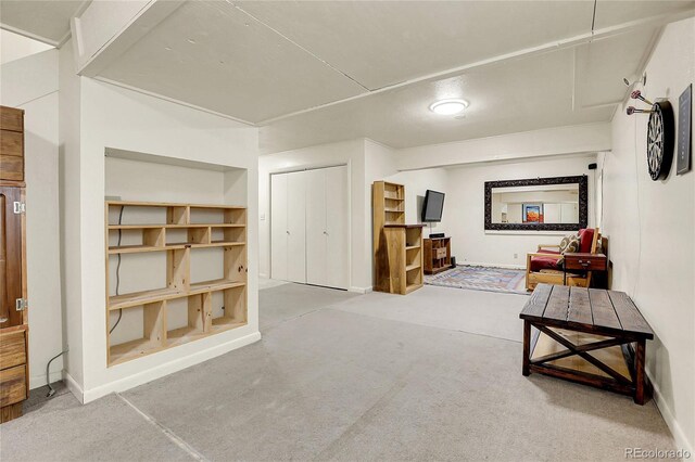 bonus room with baseboards and carpet