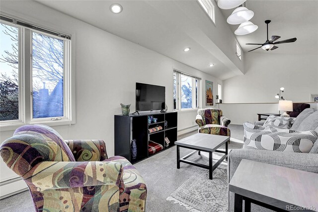 living area with a baseboard radiator, a healthy amount of sunlight, a baseboard heating unit, and recessed lighting