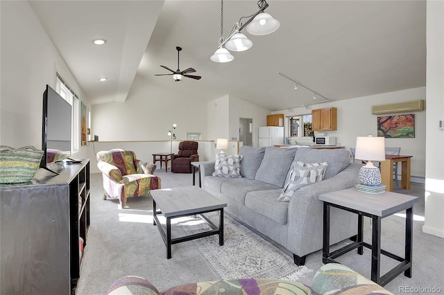 living room with a ceiling fan, track lighting, baseboards, light colored carpet, and lofted ceiling