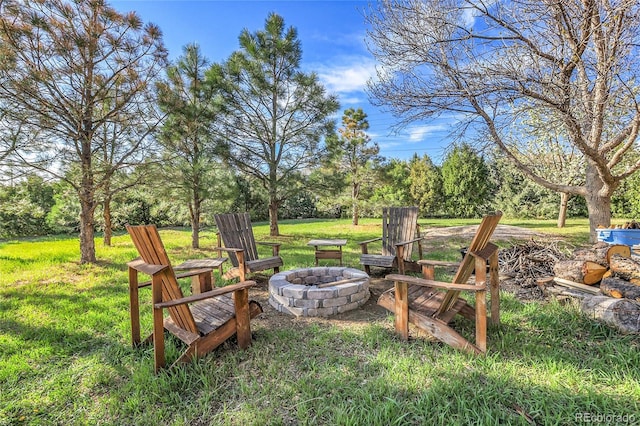 view of yard with an outdoor fire pit