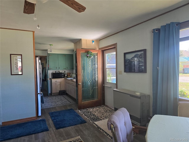 interior space featuring ceiling fan, plenty of natural light, and hardwood / wood-style floors