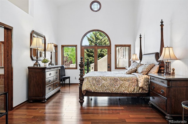 5904 Meadowbrook Dr, Morrison, CO 80465 - bedroom with a high ceiling, dark wood-style flooring, and baseboards