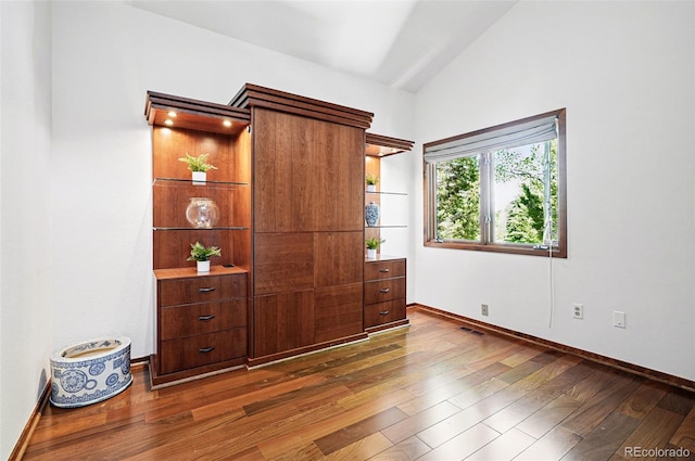 5904 Meadowbrook Dr, Morrison, CO 80465 - bedroom featuring wood-type flooring, baseboards, and vaulted ceiling