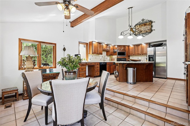 5904 Meadowbrook Dr, Morrison, CO 80465 - dining space with ceiling fan, high vaulted ceiling, light tile patterned floors, and beamed ceiling