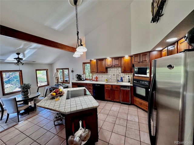 5904 Meadowbrook Dr, Morrison, CO 80465 - kitchen featuring black appliances, a sink, tile countertops, tasteful backsplash, and light tile patterned flooring