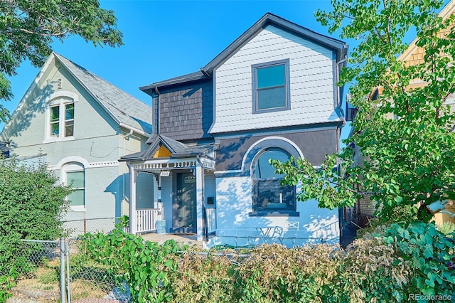 view of front of house with fence