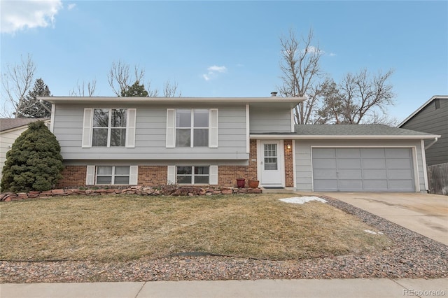 view of front facade with a garage and a front lawn