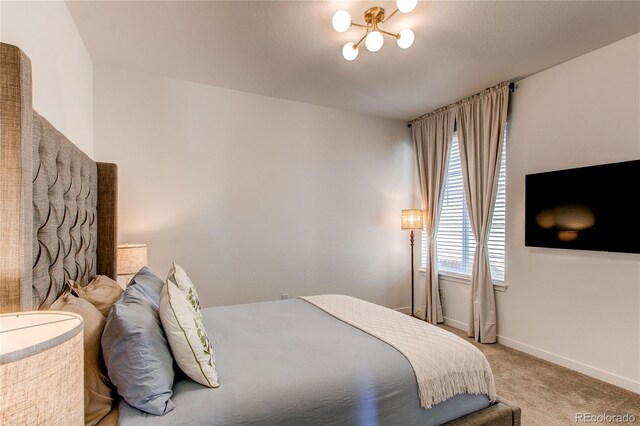 bedroom featuring carpet floors and baseboards