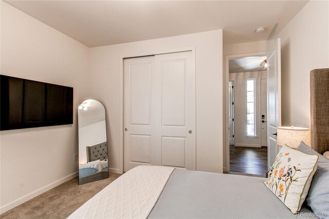 bedroom with a closet and baseboards
